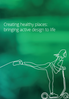 Green gradient background with white text "Creating healthy places: bringing active design to life" and white line drawing of person on scooter.