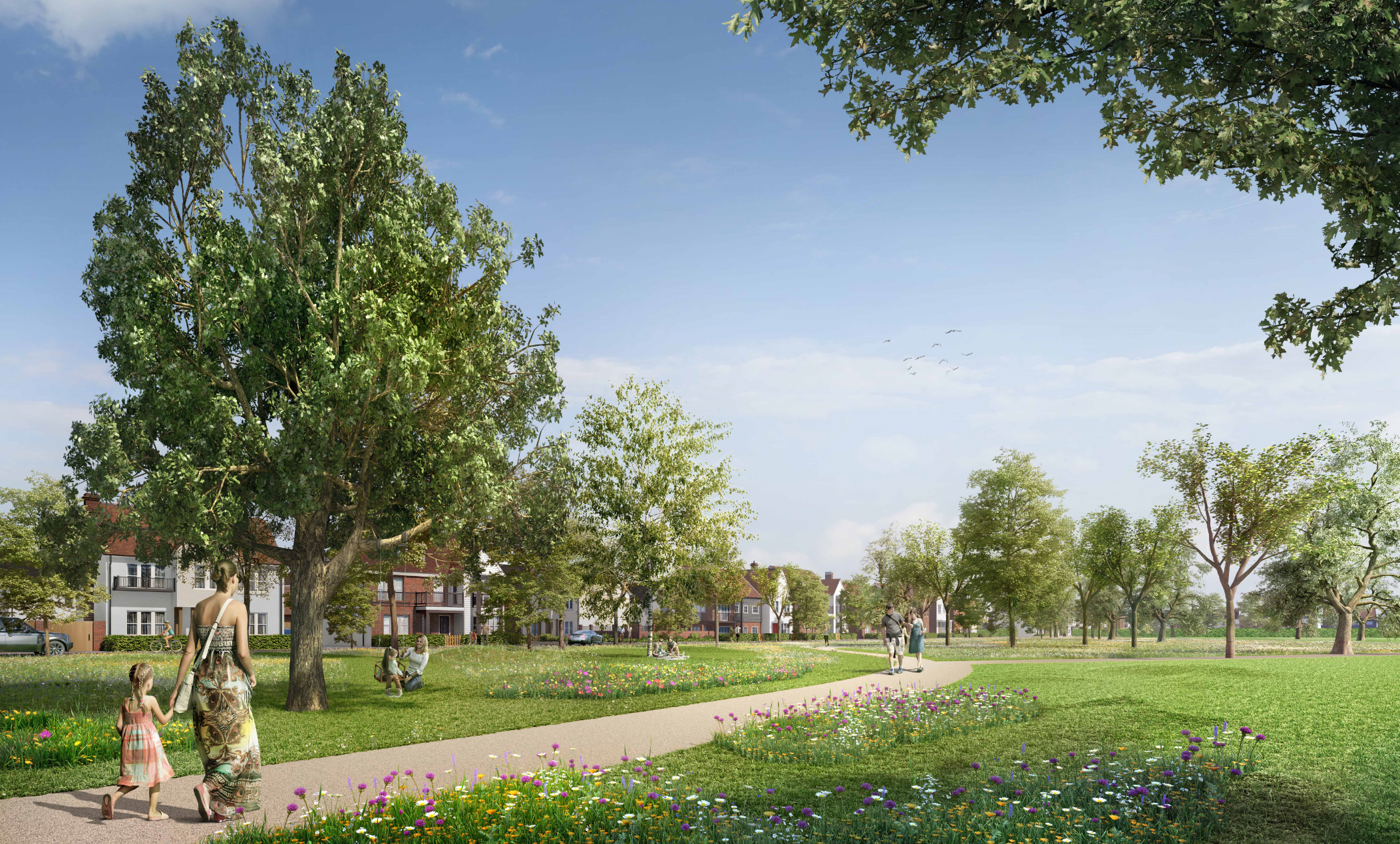 Tree-lined pathway through green park with scattered residential buildings, people walking, and blue sky with white clouds.