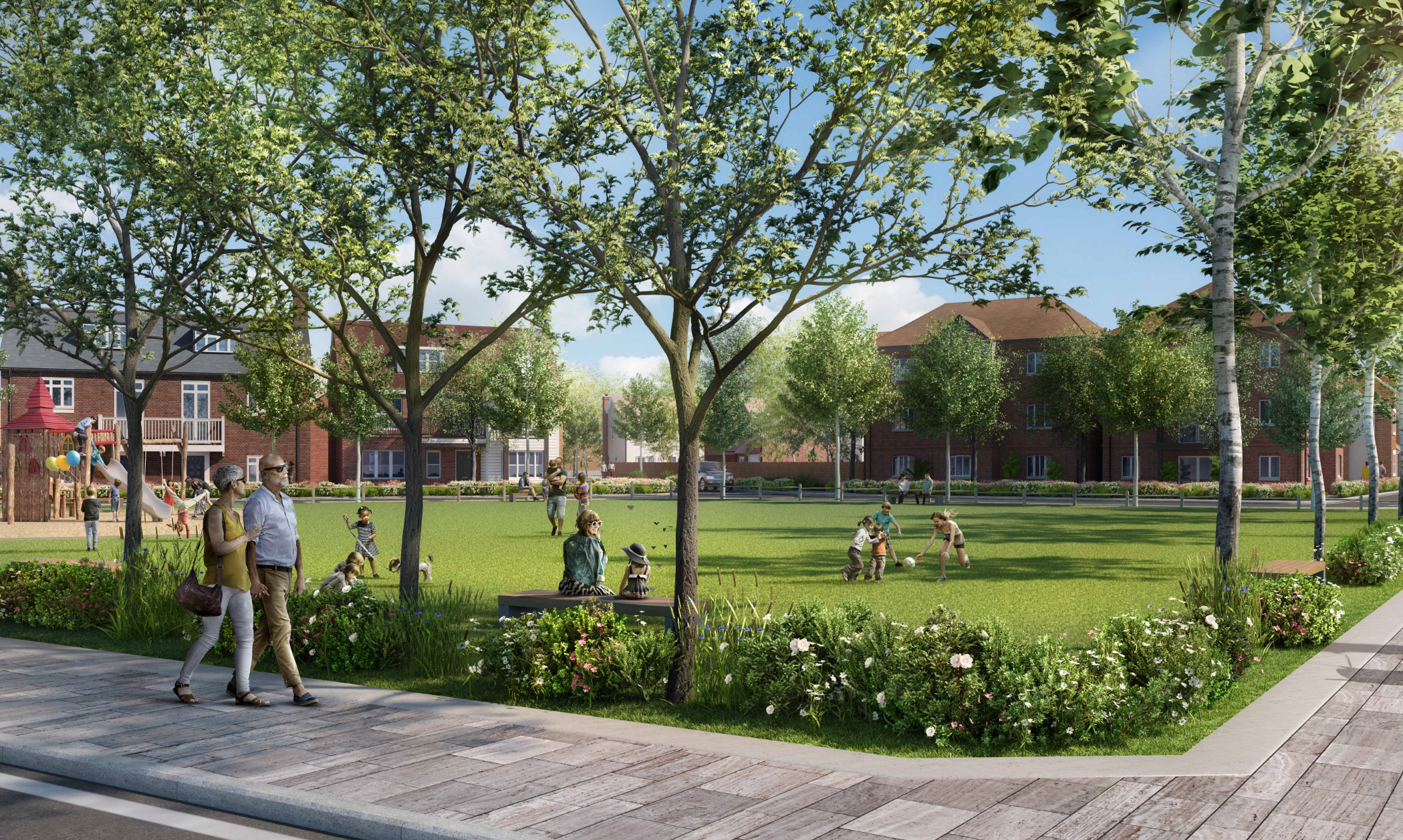 Green park with large trees, people walking on paths, children playing on grass, residential buildings and blue sky in background.